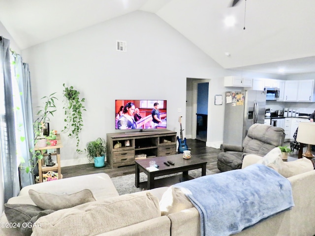 living area featuring high vaulted ceiling, visible vents, dark wood finished floors, and baseboards