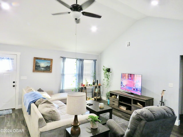 living area with baseboards, visible vents, a ceiling fan, lofted ceiling, and wood finished floors