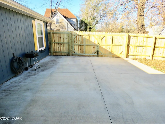 view of patio / terrace featuring a gate and fence