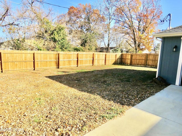 view of yard with a fenced backyard