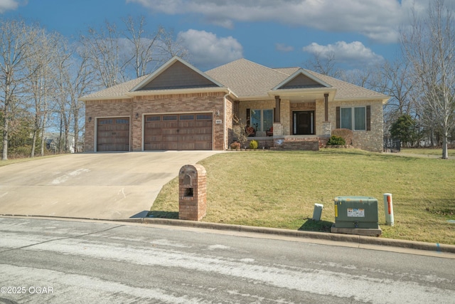 view of front of house featuring brick siding, an attached garage, a front yard, roof with shingles, and driveway