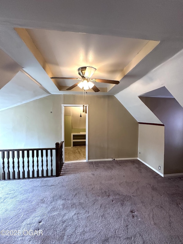 bonus room with lofted ceiling, carpet floors, a ceiling fan, and baseboards