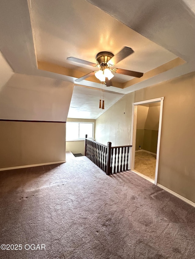 bonus room featuring vaulted ceiling, carpet floors, ceiling fan, and baseboards