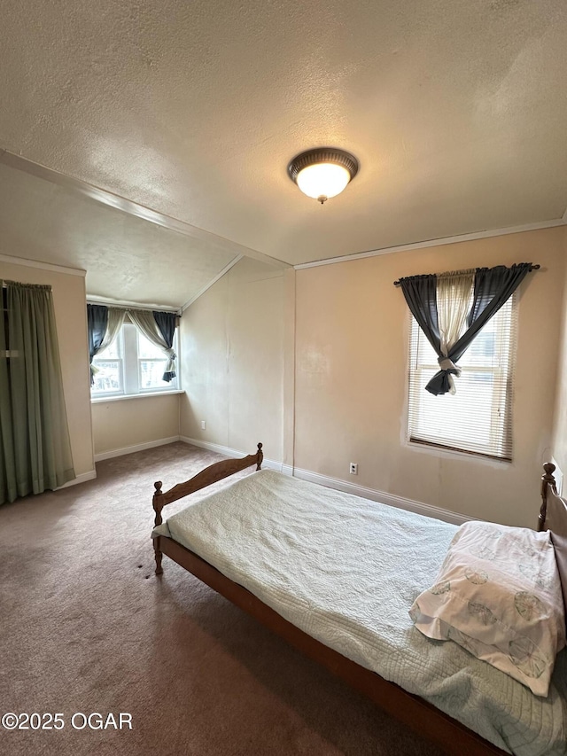 unfurnished bedroom with a textured ceiling, carpet, and baseboards