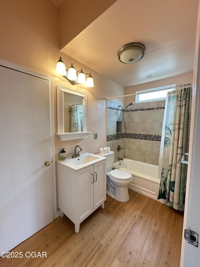 full bath with vanity, wood finished floors, toilet, and shower / bathtub combination with curtain