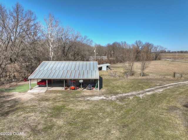 exterior space with a yard and a carport