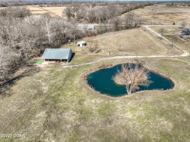 aerial view with a rural view and a water view