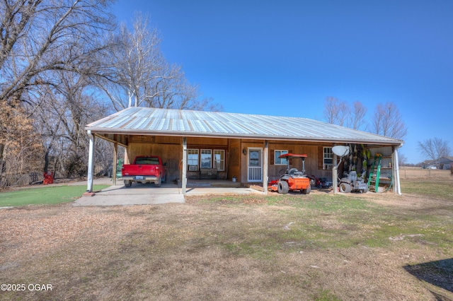 view of outdoor structure featuring an attached carport