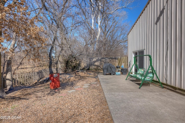 view of yard featuring a patio and a fenced backyard