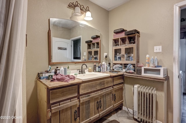 bathroom featuring vanity and radiator