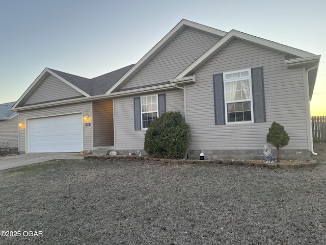 ranch-style house with a garage and driveway