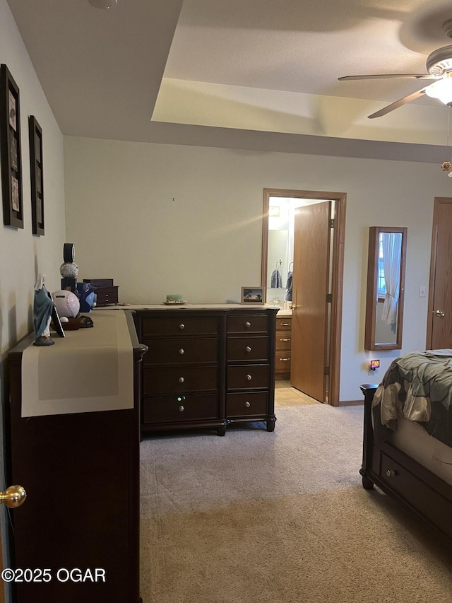 bedroom with light carpet and a ceiling fan