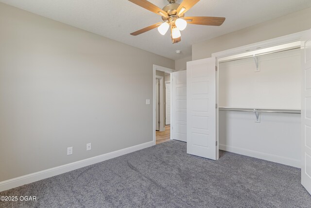 unfurnished bedroom featuring carpet flooring, a ceiling fan, baseboards, and a closet