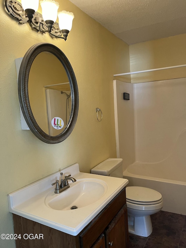 bathroom with toilet,  shower combination, a textured ceiling, vanity, and a notable chandelier