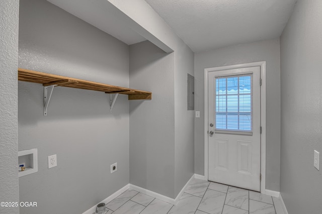 doorway featuring marble finish floor, electric panel, a textured ceiling, and baseboards