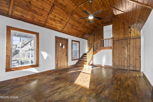 unfurnished living room featuring lofted ceiling, wooden ceiling, stairway, and hardwood / wood-style flooring