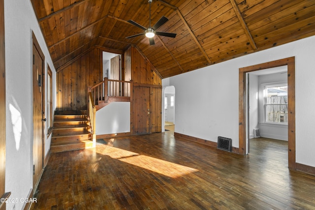 unfurnished living room featuring lofted ceiling, wood-type flooring, wood ceiling, and baseboards