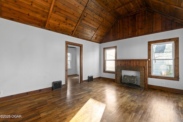 unfurnished living room featuring wooden ceiling, wood-type flooring, a brick fireplace, and visible vents