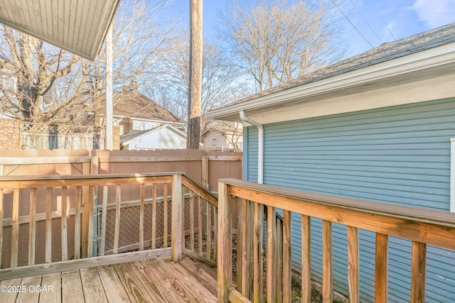 wooden terrace featuring fence