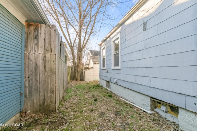 view of property exterior featuring fence