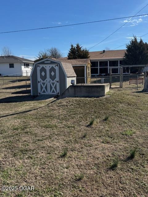 view of shed with fence