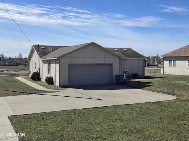 view of property exterior featuring roof with shingles, a yard, concrete driveway, board and batten siding, and a garage