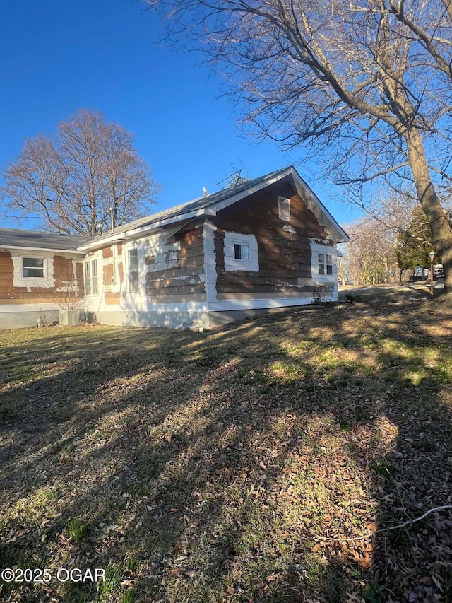 view of property exterior featuring a yard