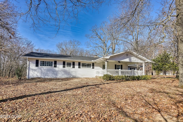 single story home with a porch and a ceiling fan