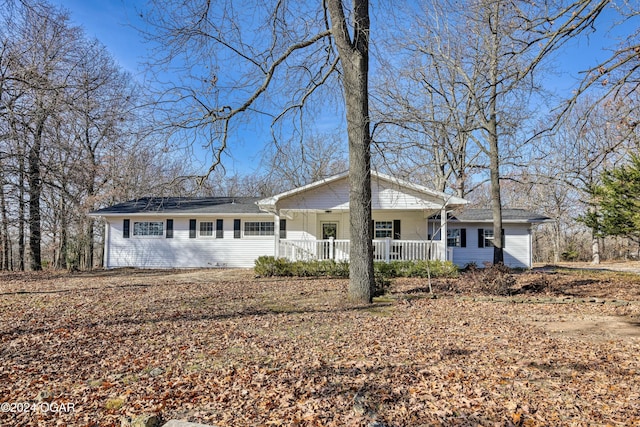 ranch-style home with a porch