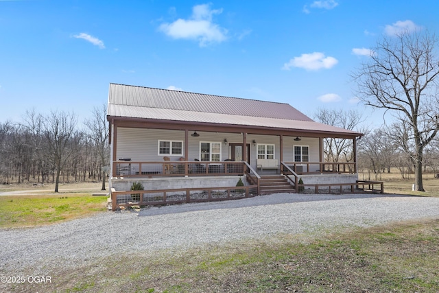 view of front of house with covered porch and metal roof