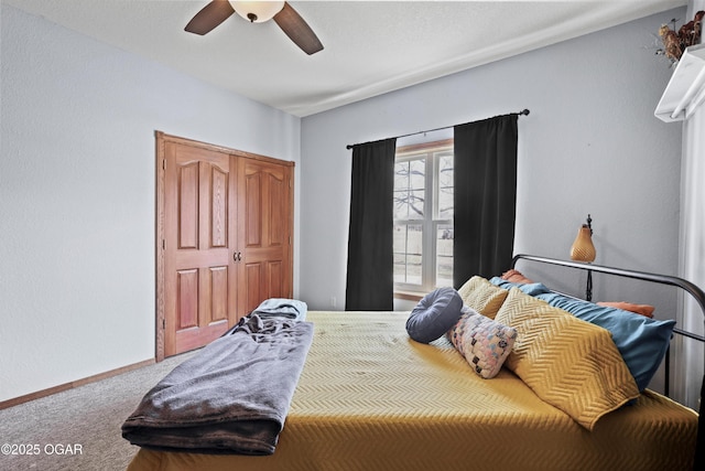 bedroom featuring ceiling fan, baseboards, and carpet floors