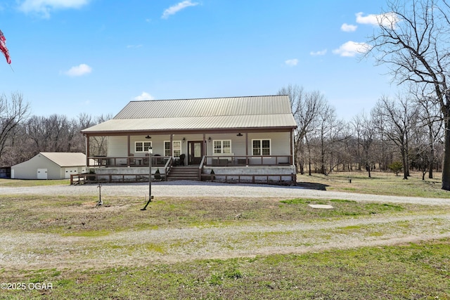 view of front of home featuring a porch and metal roof