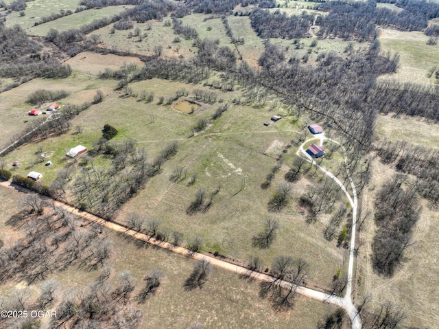 birds eye view of property featuring a rural view