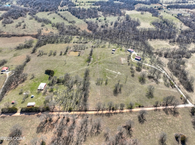 birds eye view of property featuring a rural view