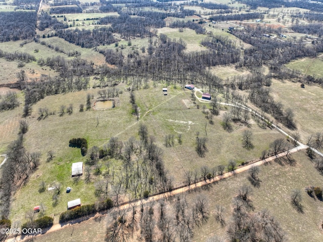 birds eye view of property with a rural view