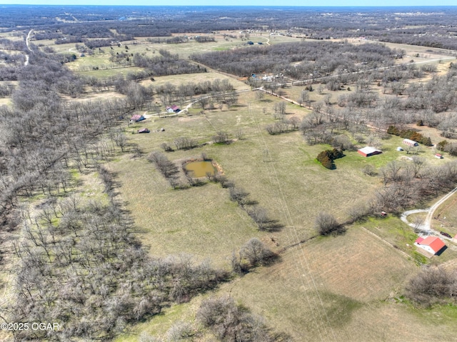 birds eye view of property featuring a rural view