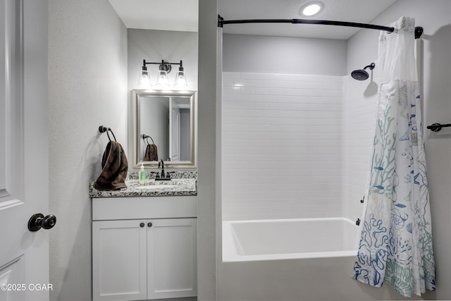 bathroom featuring vanity and shower / tub combo