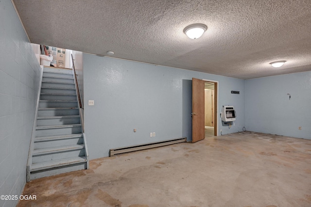 finished below grade area with concrete block wall, stairway, heating unit, a textured ceiling, and a baseboard heating unit