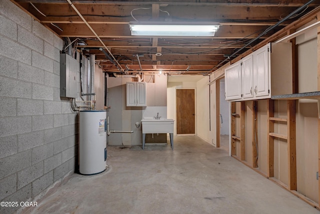 unfinished below grade area featuring electric panel, water heater, and a sink