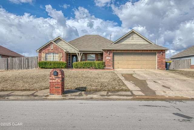 view of front of house with concrete driveway, brick siding, an attached garage, and fence