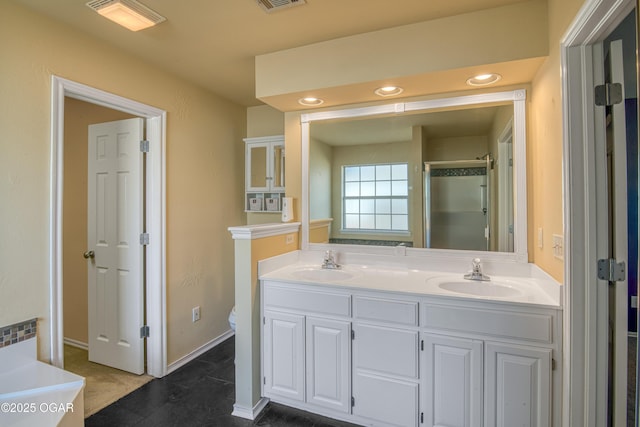 bathroom with visible vents, a sink, a shower stall, and double vanity