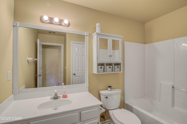 bathroom featuring toilet and vanity