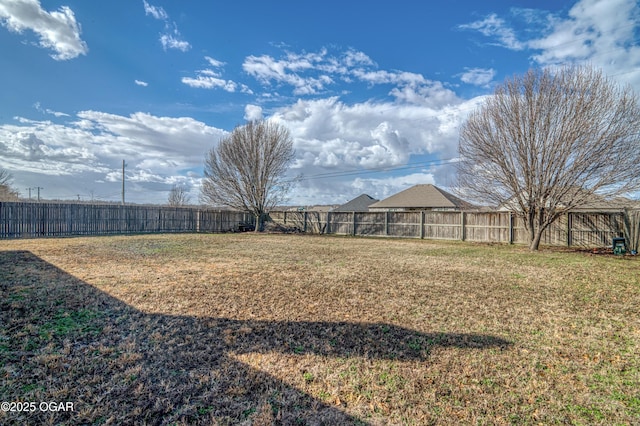 view of yard featuring a fenced backyard