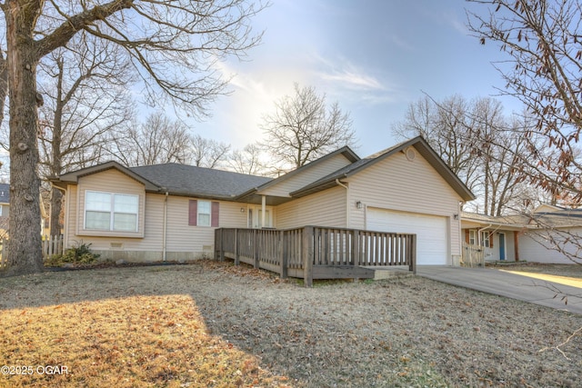 ranch-style home featuring a garage, driveway, and a shingled roof