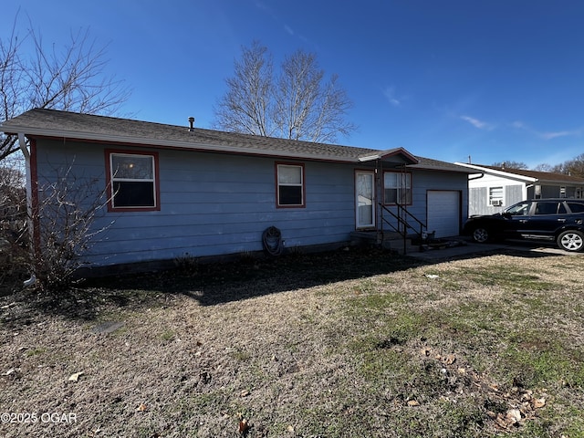 ranch-style house featuring an attached garage