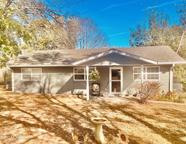 ranch-style house featuring central air condition unit