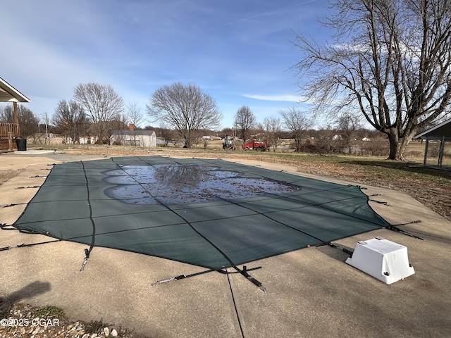 view of pool with a covered pool and a patio