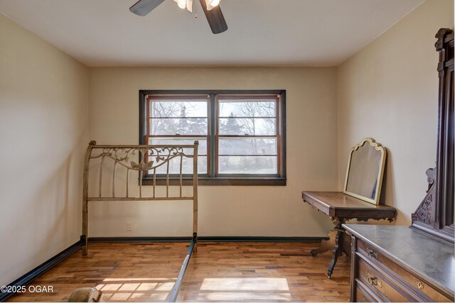 117 E Russell St, Goodman, MO 64843 - interior space with a ceiling fan, baseboards, and wood finished floors