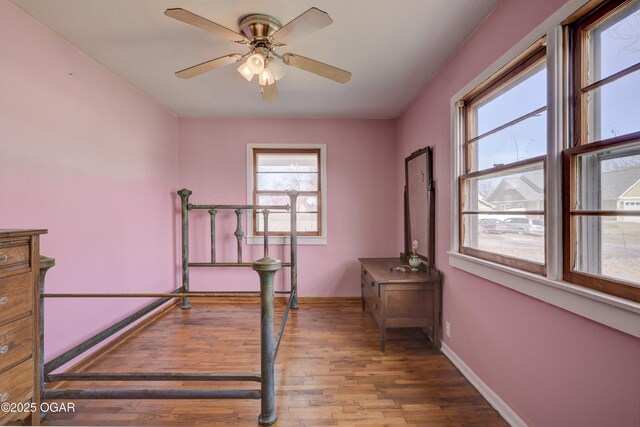 117 E Russell St, Goodman, MO 64843 - bedroom with baseboards and wood finished floors