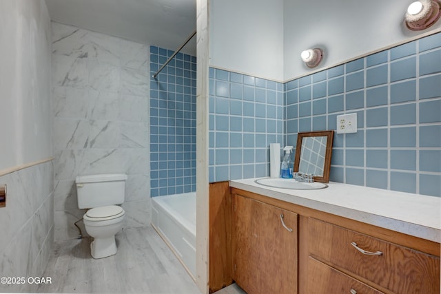 117 E Russell St, Goodman, MO 64843 - full bath with shower / bathing tub combination, tile walls, toilet, and vanity